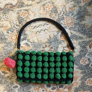 Clare V Claudette crochet purse with rattan tomato and tubular strap